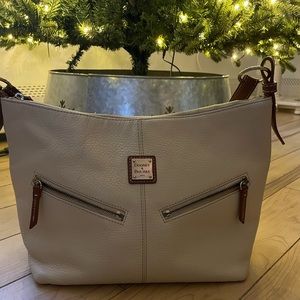 Dooney and Burke cream colored pebble hobo bag.